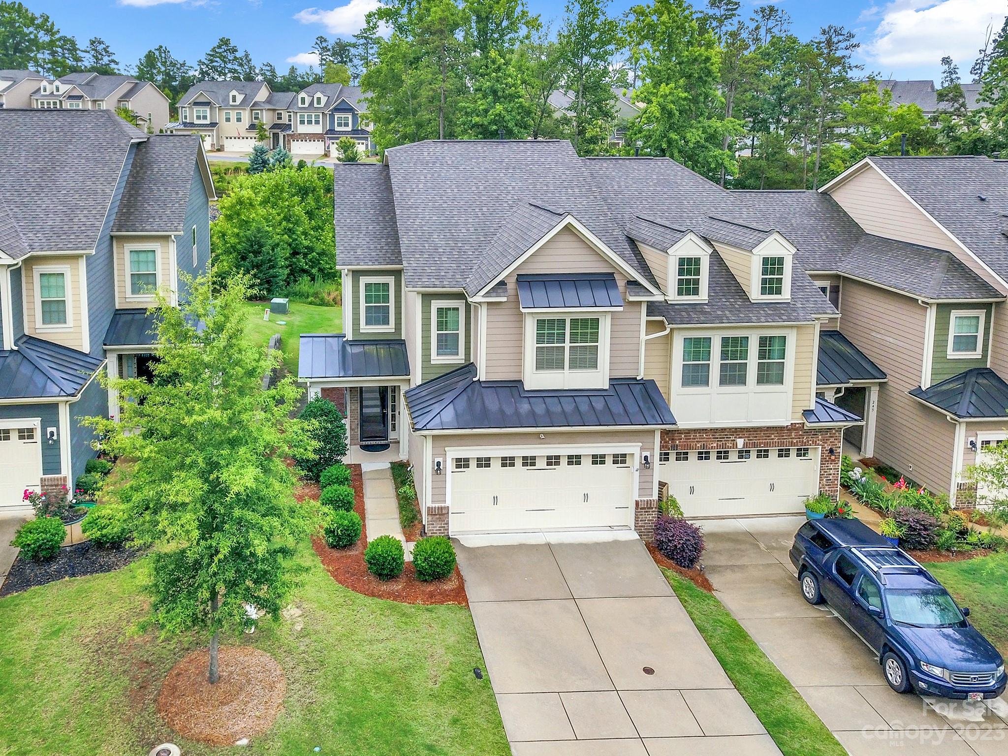 241 Butterfly Place Tega Cay, SC 29708 - Photo 35 of 42 an aerial view of a house with yard and green space
