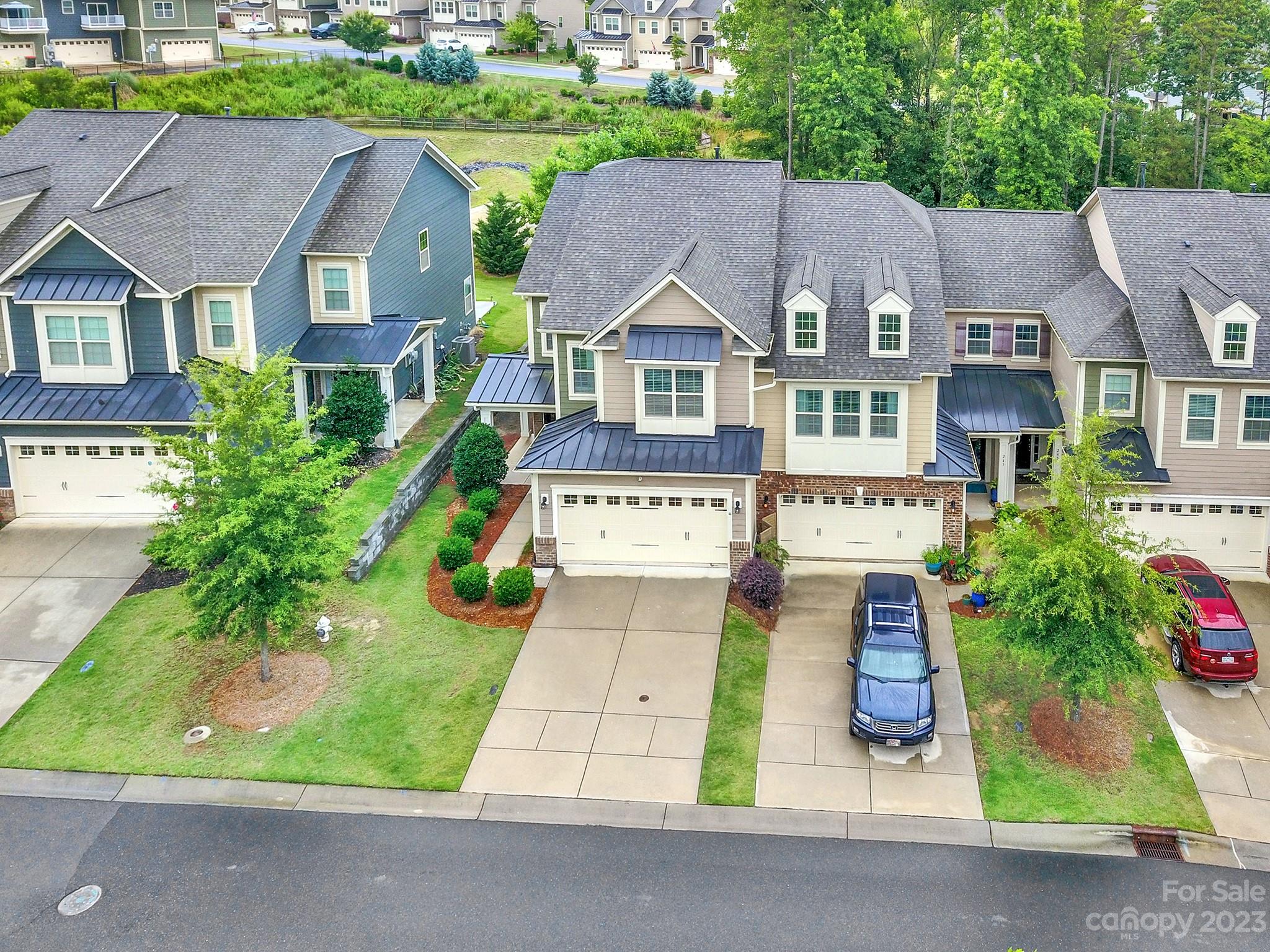 241 Butterfly Place Tega Cay, SC 29708 - Photo 36 of 42 an aerial view of multiple houses with a yard