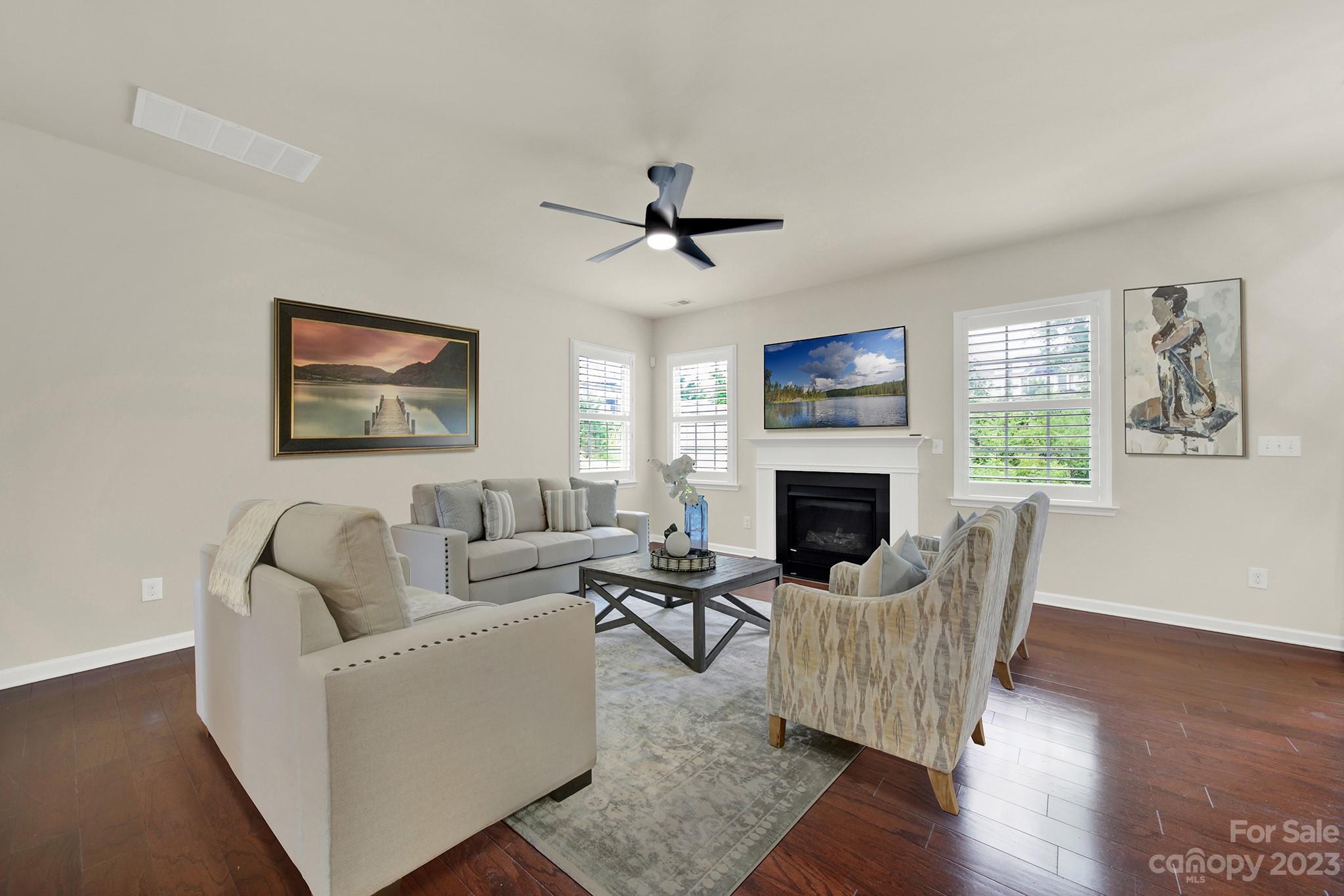 241 Butterfly Place Tega Cay, SC 29708 - Photo 6 of 42 a living room with furniture fireplace and window
