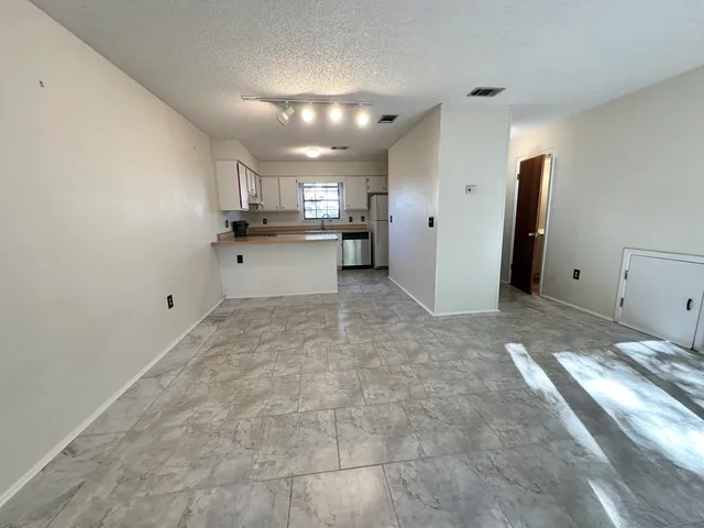a view of an empty room with a sink
