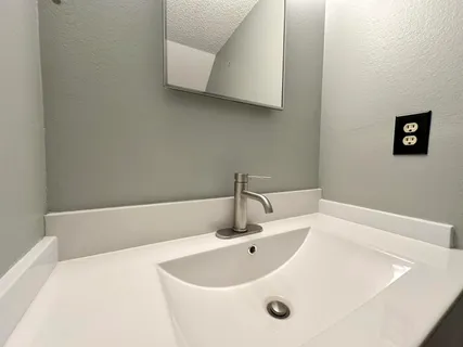 a view of a bathroom from a hallway
