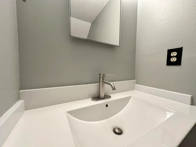 a view of a bathroom from a hallway