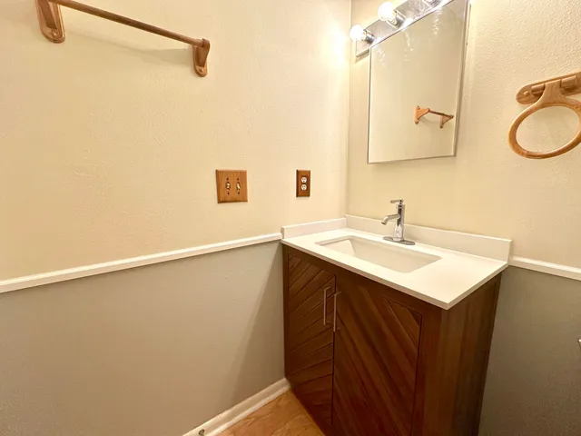 a view of storage and utility room with sink