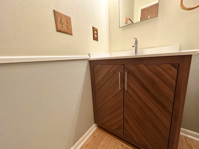 a view of a house with a tree in the background