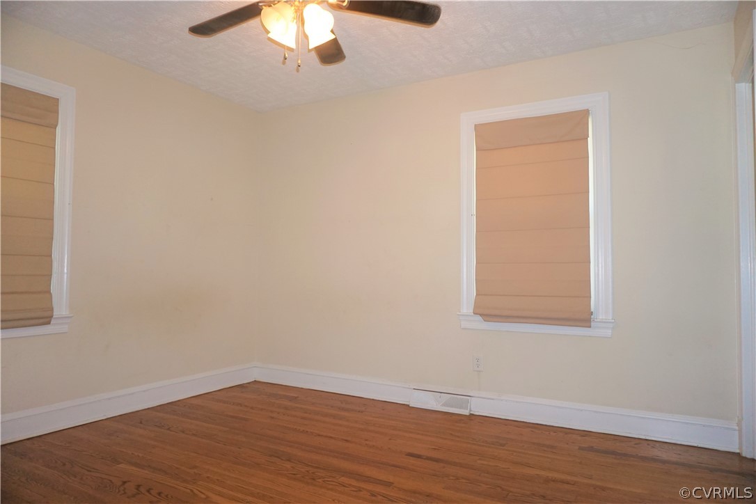 17322 Old Ridge Road Montpelier, VA 23192 - Photo 11 of 50 an empty room with wooden floor and windows