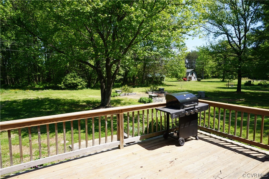 17322 Old Ridge Road Montpelier, VA 23192 - Photo 23 of 50 a view of a roof deck with wooden fence and trees