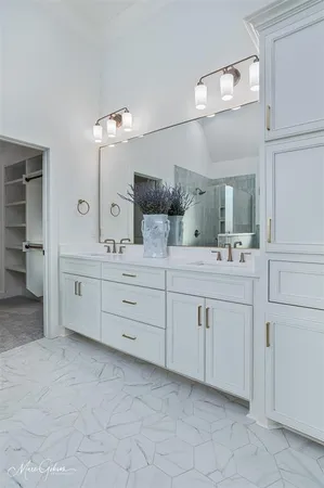 a bathroom with a double vanity sink mirror and a