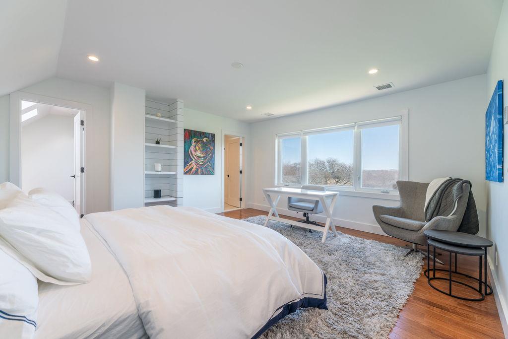 1030 Horseshoe Drive Cutchogue, NY 11935 - Photo 16 of 19 a bedroom with a bed and wooden floor