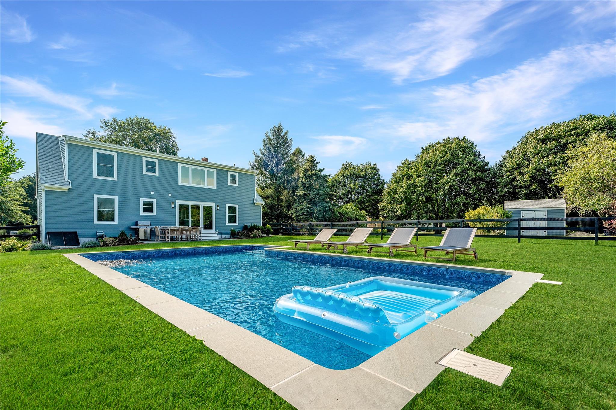 1030 Horseshoe Drive Cutchogue, NY 11935 - Photo 19 of 19 a view of a house with swimming pool and a yard