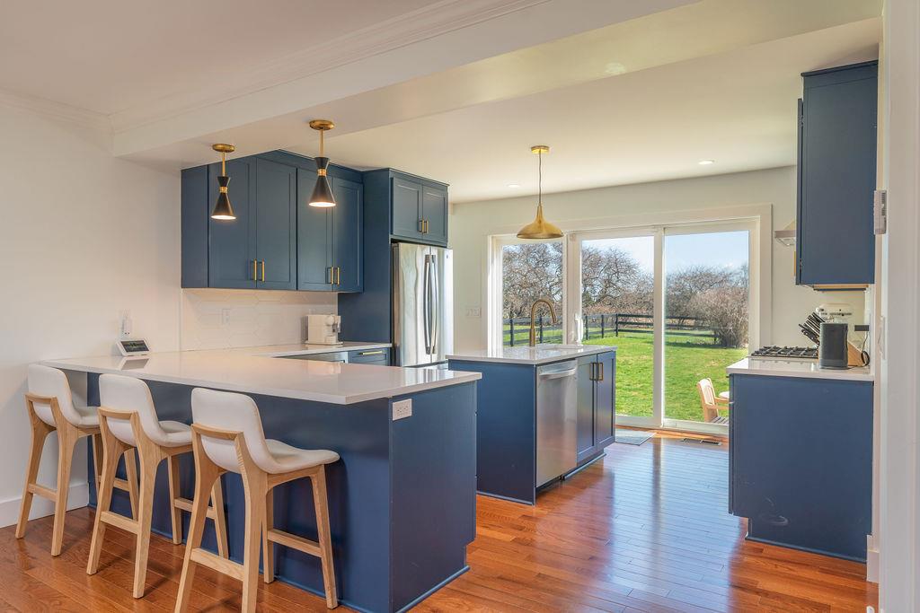 1030 Horseshoe Drive Cutchogue, NY 11935 - Photo 6 of 19 a dining hall with stainless steel appliances granite countertop a kitchen island a stove and a sink