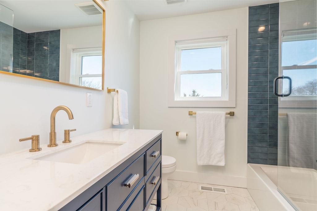 1030 Horseshoe Drive Cutchogue, NY 11935 - Photo 10 of 19 a bathroom with a sink and a mirror
