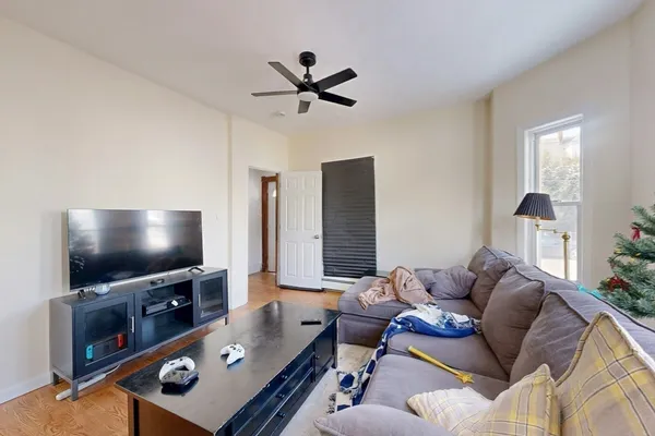 a living room with furniture and a flat screen tv