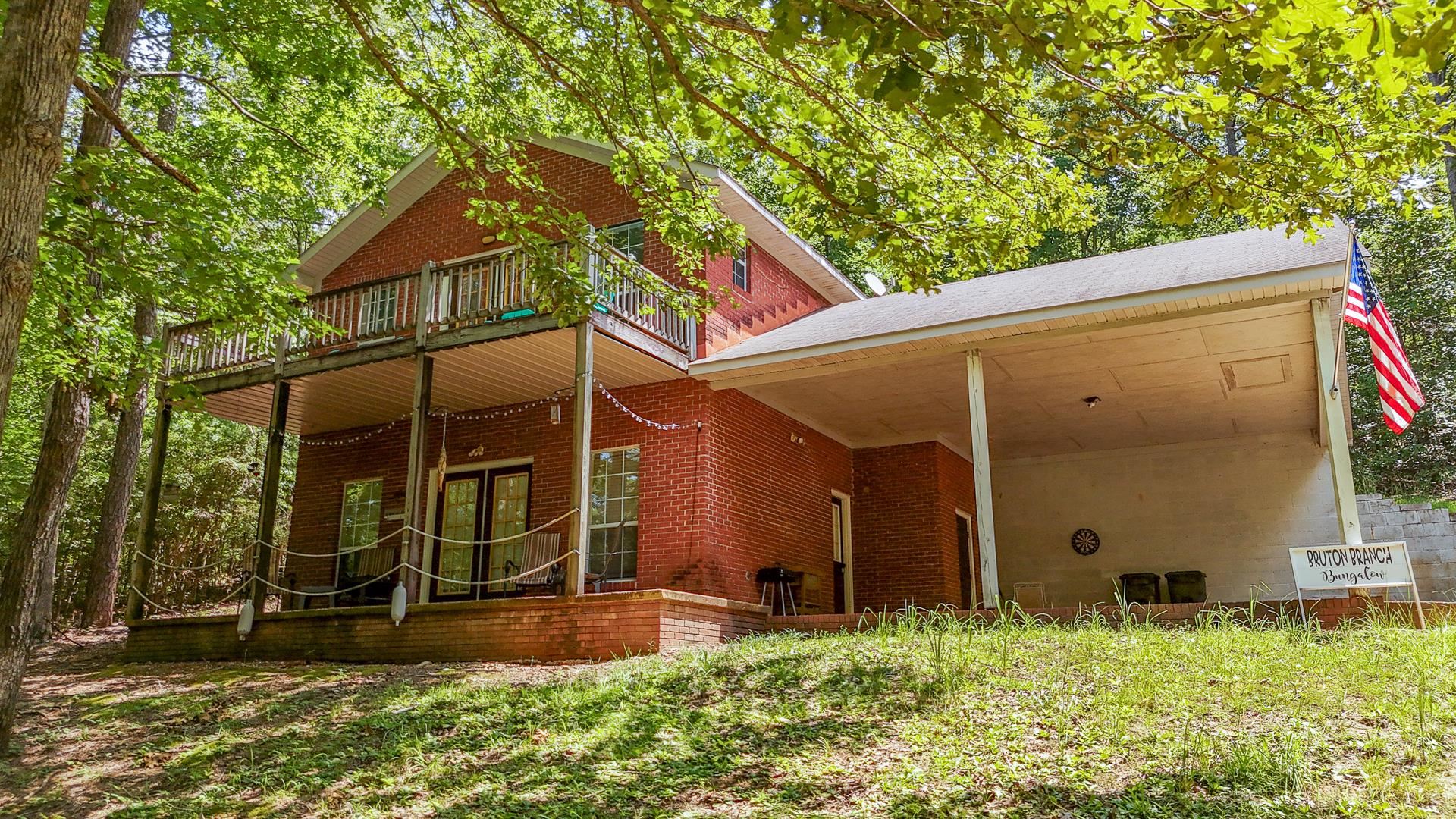 a backyard of a house with lots of green space