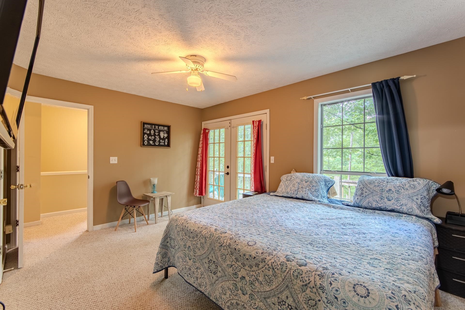 2125 Bruton Branch Road Savannah, TN 38372 - Photo 15 of 33 a bedroom with a bed and a chandelier
