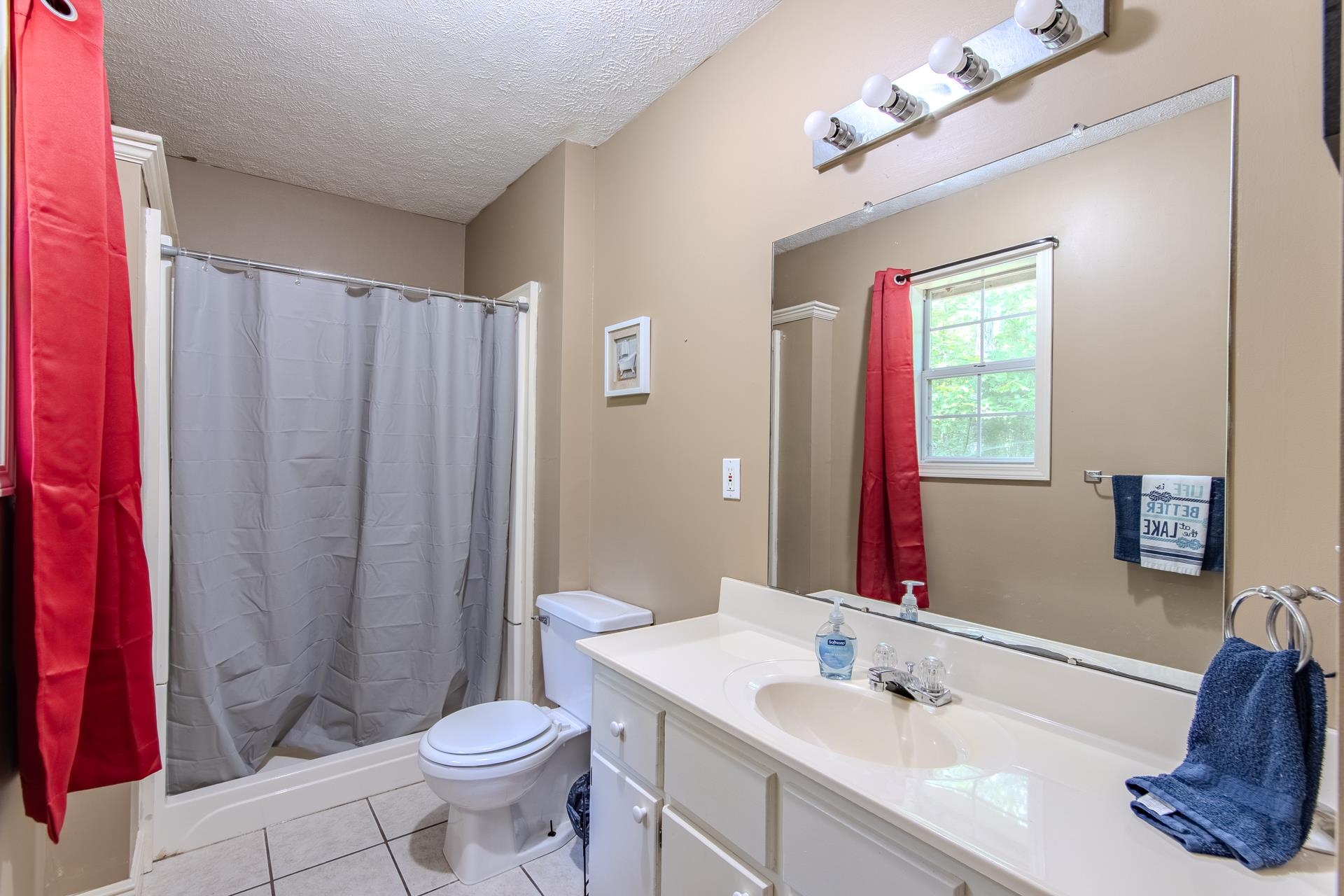 2125 Bruton Branch Road Savannah, TN 38372 - Photo 17 of 33 a bathroom with a sink toilet and shower