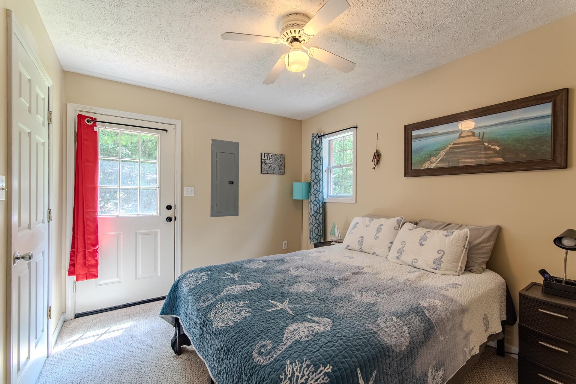 2125 Bruton Branch Road Savannah, TN 38372 - Photo 18 of 33 a bedroom with a bed and a chandelier