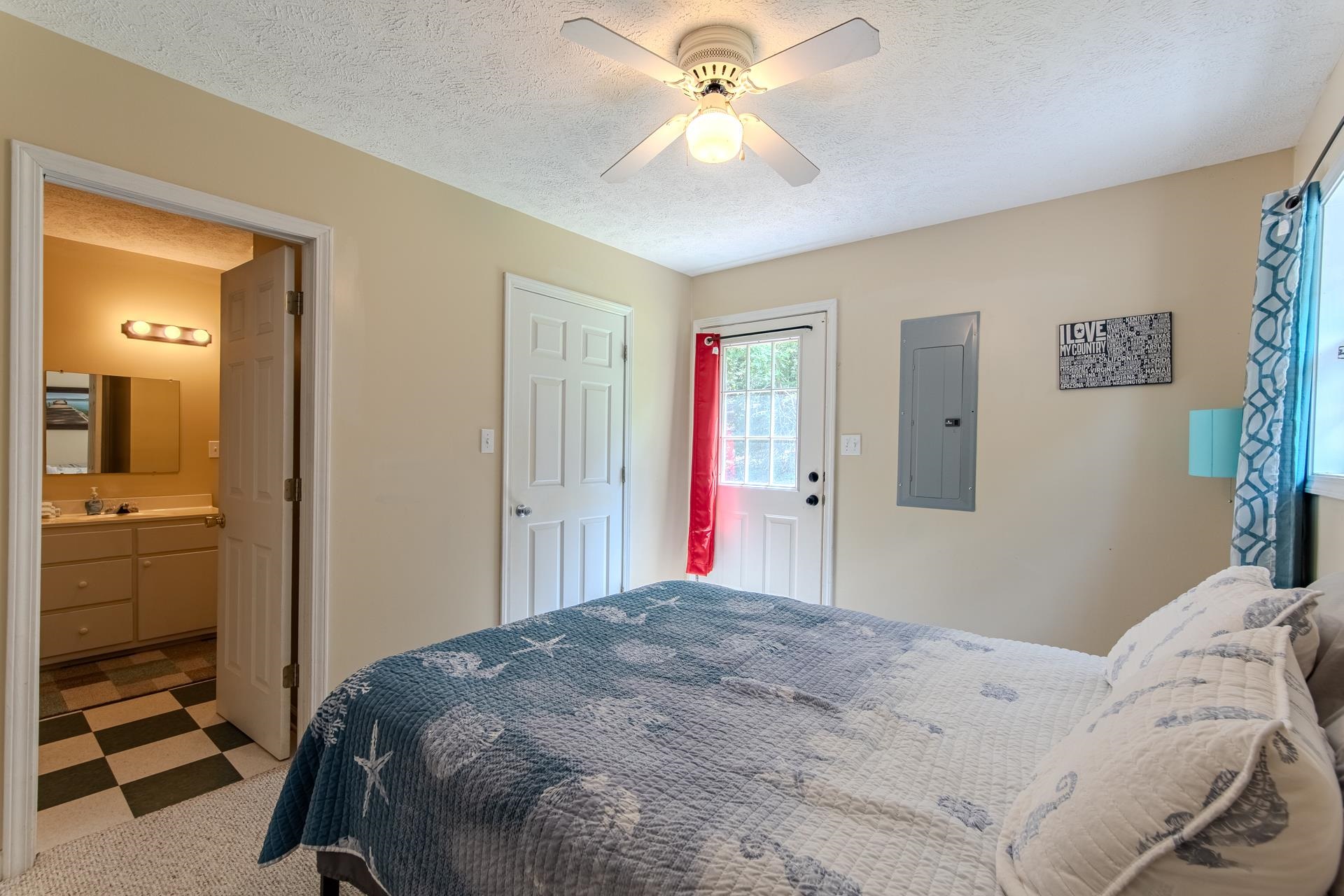 2125 Bruton Branch Road Savannah, TN 38372 - Photo 19 of 33 a bedroom with a bed and a chandelier