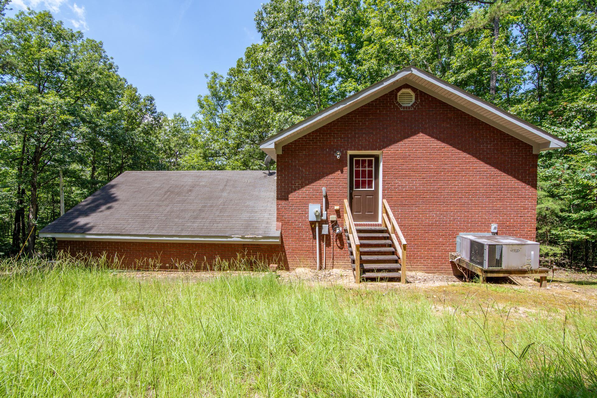 2125 Bruton Branch Road Savannah, TN 38372 - Photo 24 of 33 a backyard of a house with lots of green space