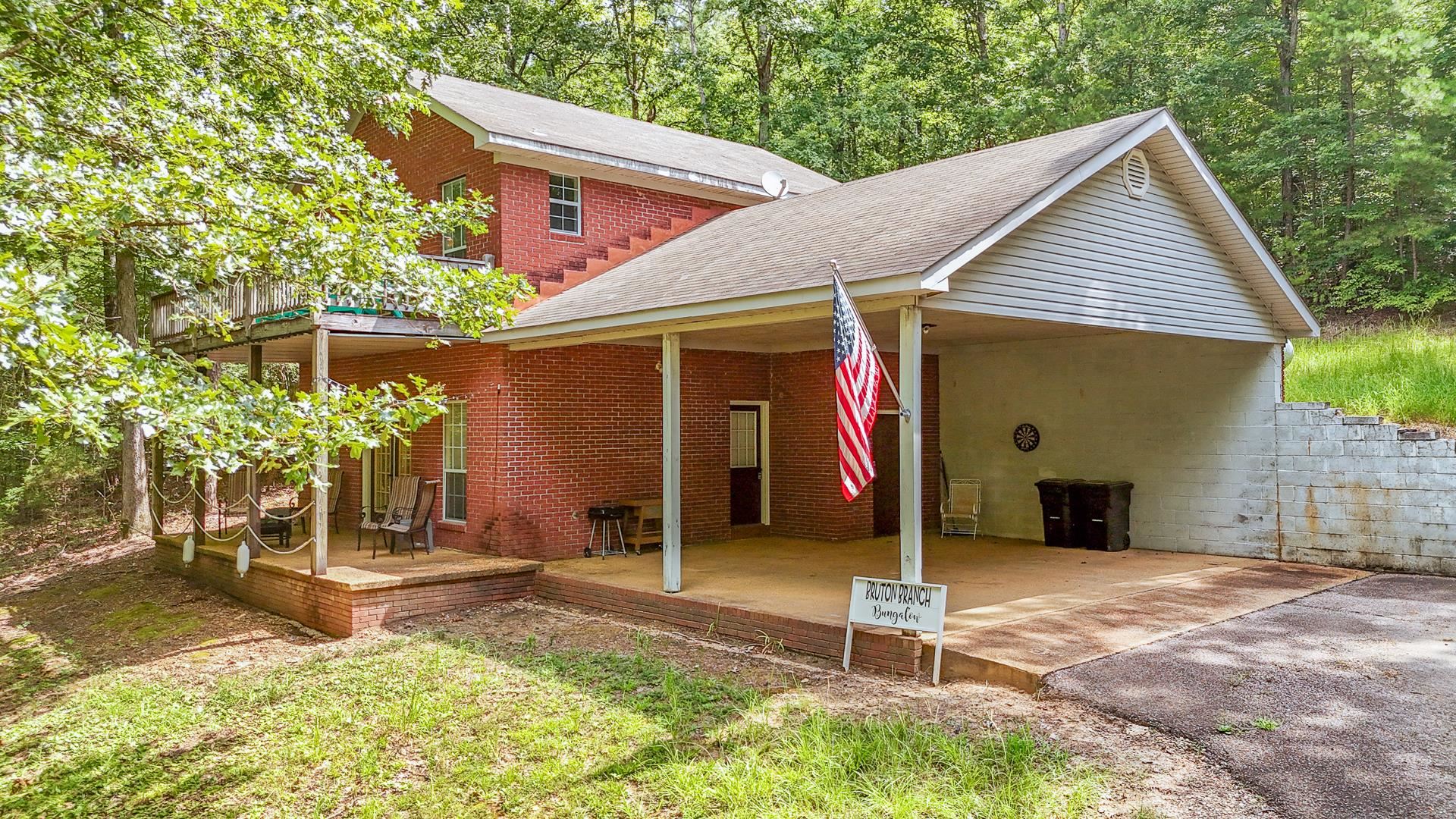 2125 Bruton Branch Road Savannah, TN 38372 - Photo 25 of 33 a house with trees in the background