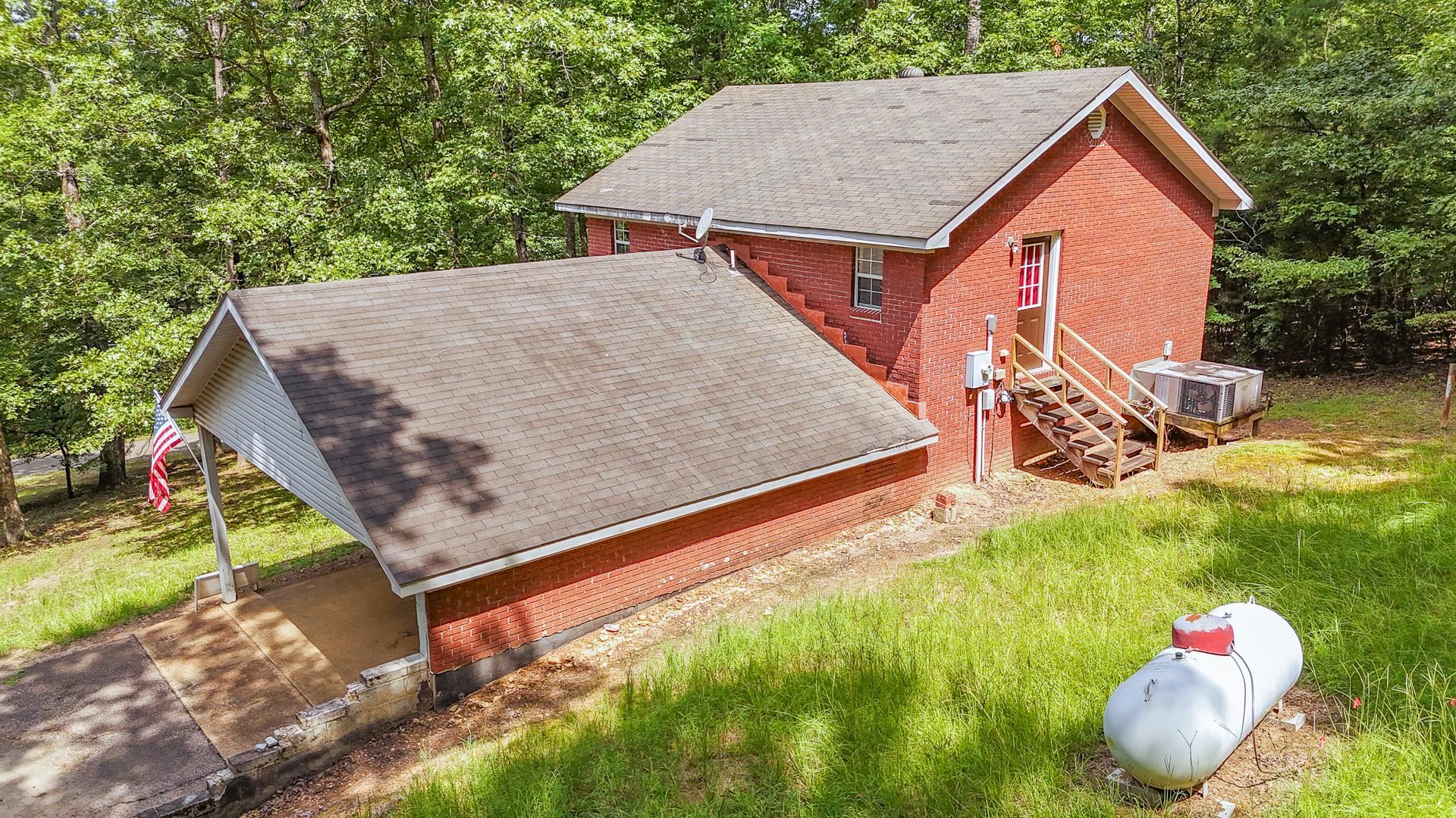 2125 Bruton Branch Road Savannah, TN 38372 - Photo 26 of 33 a backyard of a house with table and chairs