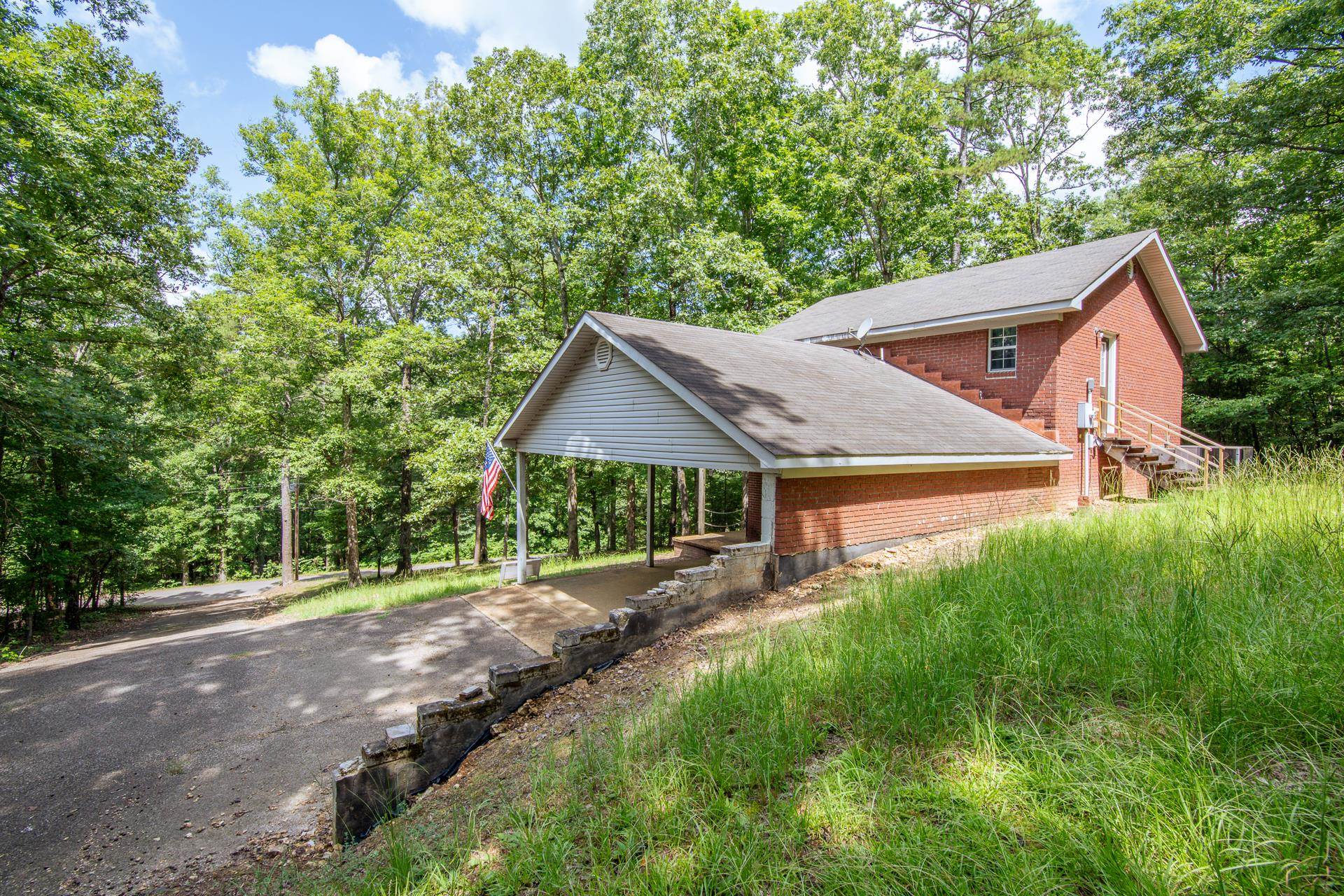 2125 Bruton Branch Road Savannah, TN 38372 - Photo 3 of 33 a view of a house with yard and a garden