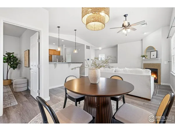 a kitchen with stainless steel appliances granite countertop a refrigerator a sink and a stove