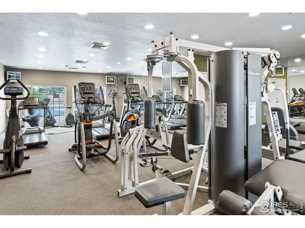 a view of a swimming pool with an outdoor seating and a yard