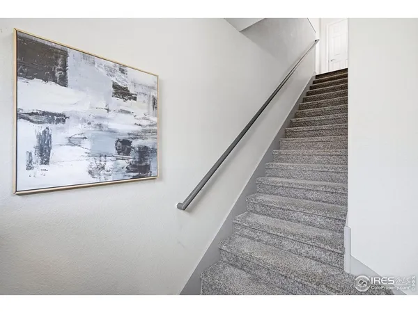 a view of a hallway with stairs