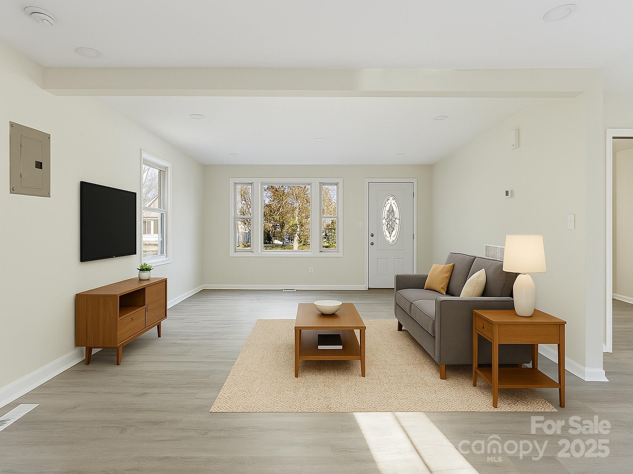 2729 Springbrook Circle Gastonia, NC 28052 - Photo 11 of 37 a living room with furniture and a flat screen tv