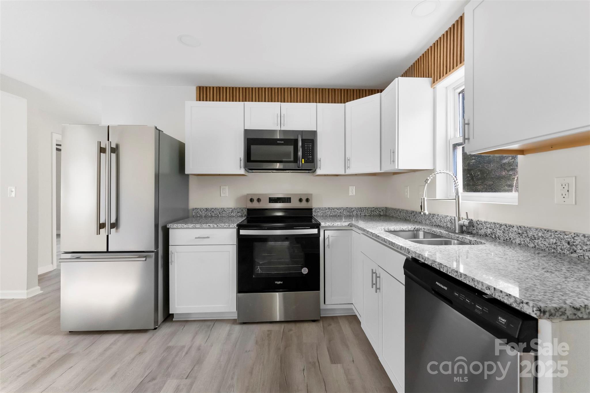 2729 Springbrook Circle Gastonia, NC 28052 - Photo 13 of 37 a kitchen with stainless steel appliances granite countertop a refrigerator sink and microwave
