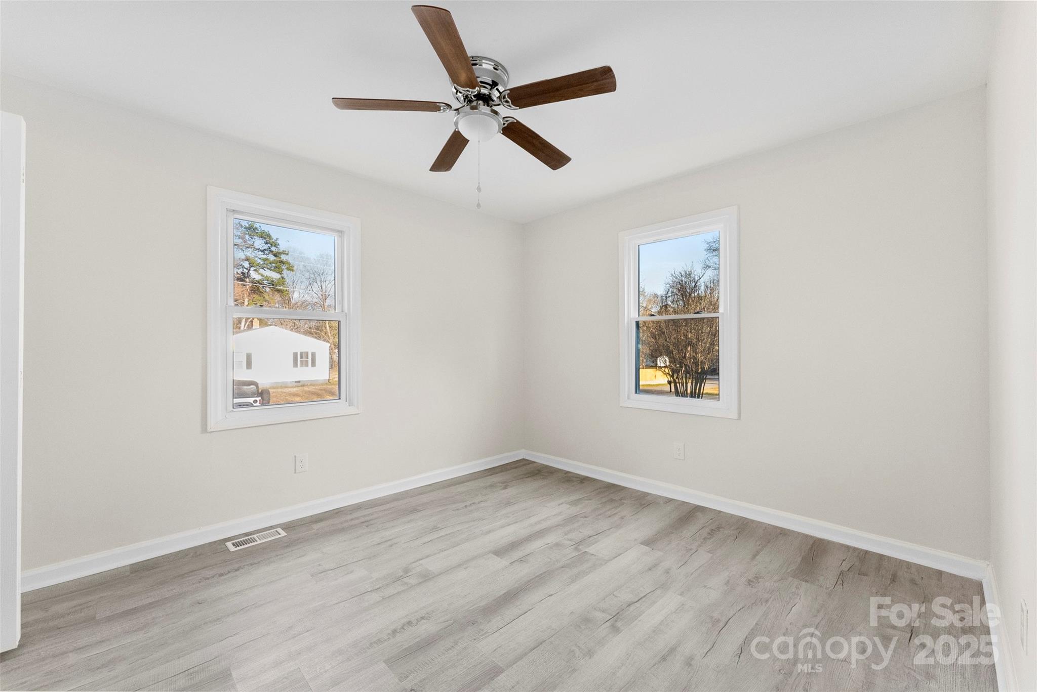 2729 Springbrook Circle Gastonia, NC 28052 - Photo 24 of 37 wooden floor in an empty room with a window