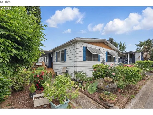 a view of house with yard and entertaining space