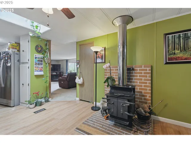 a view of a dining room with furniture and a chandelier
