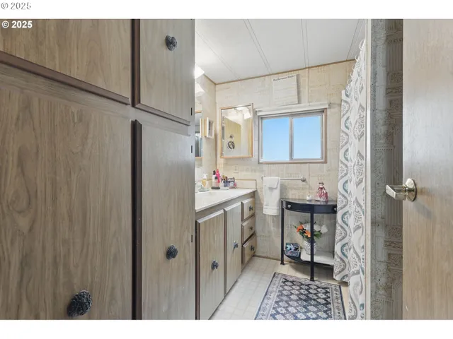 a kitchen with a refrigerator and a sink
