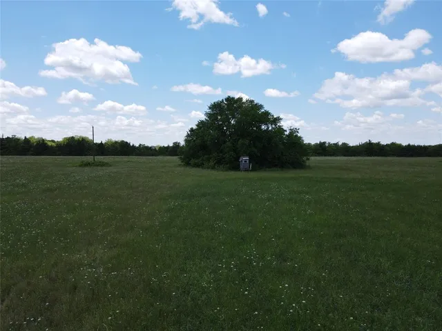 a view of a golf course with a lake