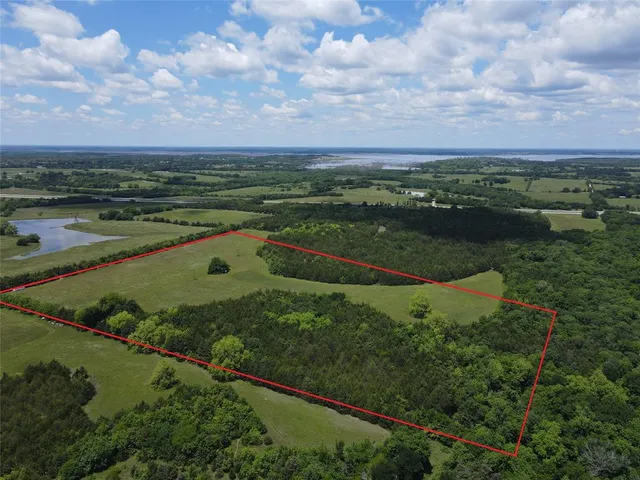 a view of a lake with a yard