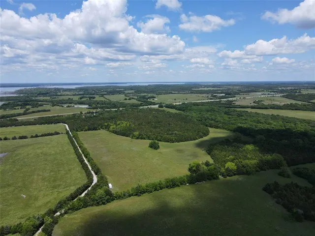 an aerial view of a golf course with swimming pool