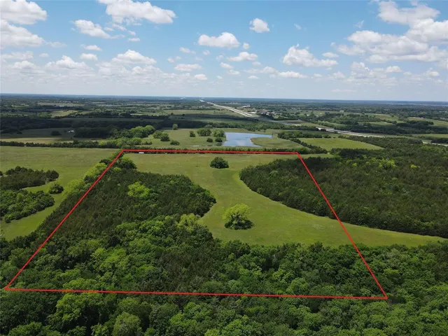 a view of a lake with a yard