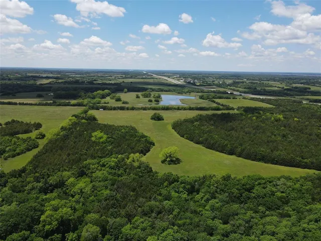 a view of a lake with a yard