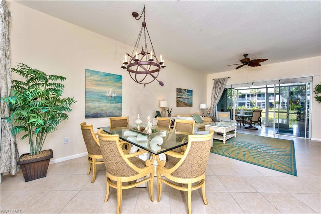 4529 Cardinal Cove Lane, Unit 7 Naples, FL 34114 - Photo 13 of 26 a view of a dining room with furniture window and outside view