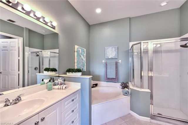 a bathroom with a double vanity sink mirror and double