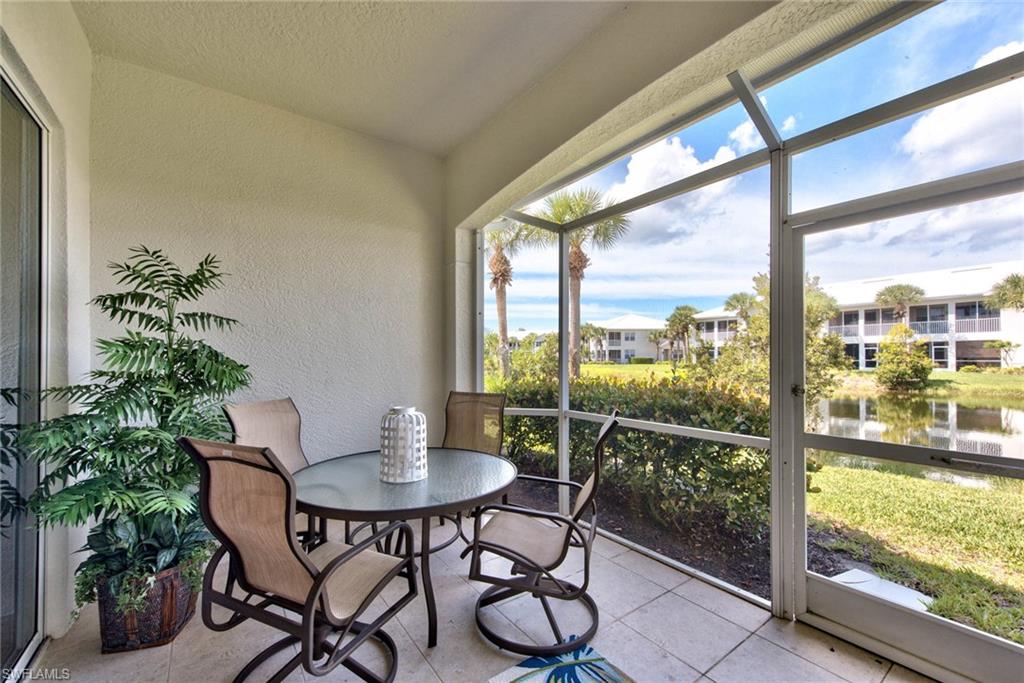 4529 Cardinal Cove Lane, Unit 7 Naples, FL 34114 - Photo 19 of 26 a view of a room with a table and chairs