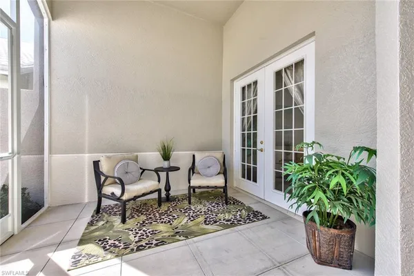 a living room with patio furniture