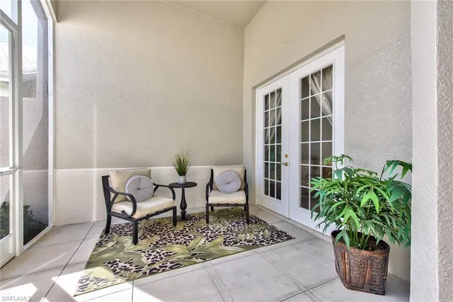 a living room with patio furniture