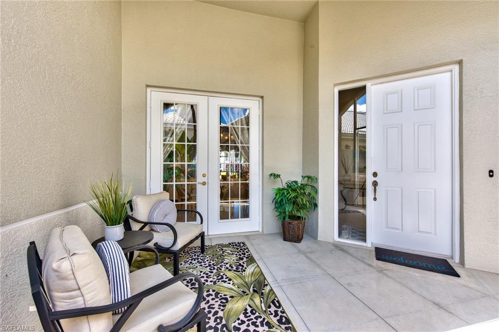 4529 Cardinal Cove Lane, Unit 7 Naples, FL 34114 - Photo 23 of 26 a living room with furniture