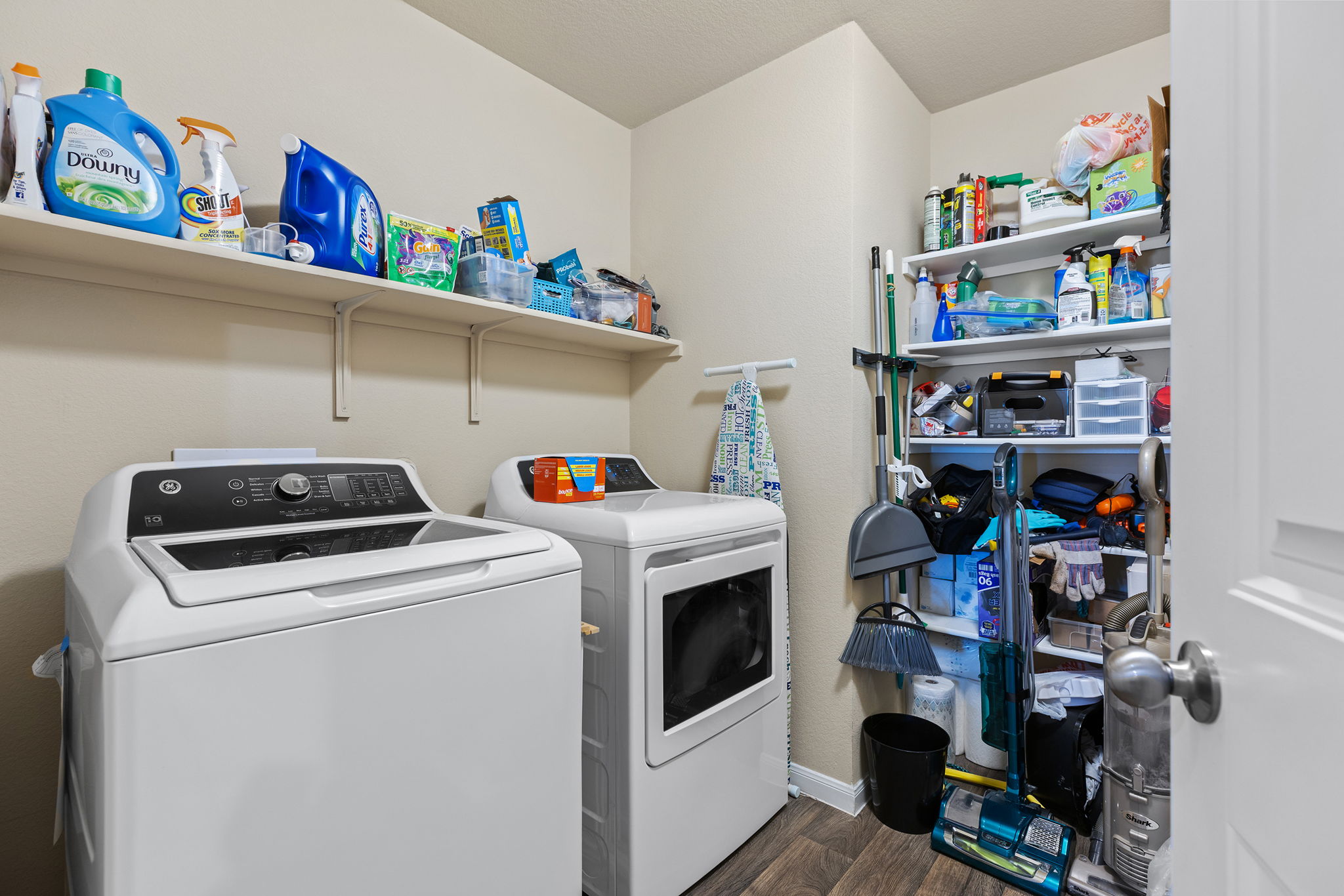 404 Cassandra Drive Hutto, TX 78634 - Photo 34 of 40 Laundry area with dark wood finished floors and washer and clothes dryer