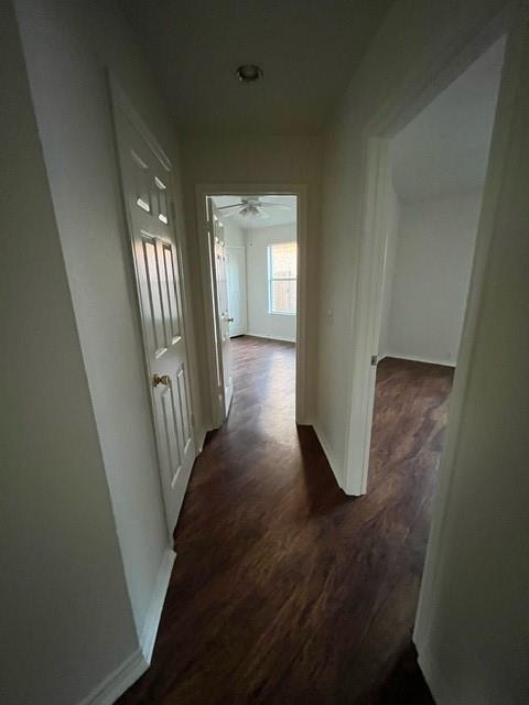 908 Rocking Spur Cove Pflugerville, TX 78660 - Photo 17 of 28 a view of a hallway with wooden floor and stairs