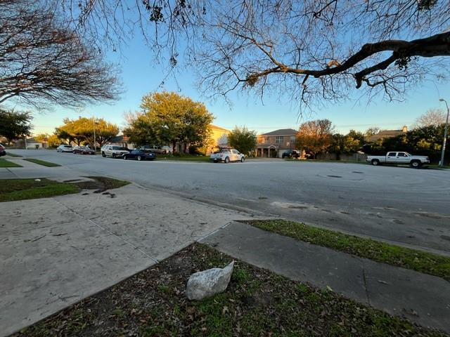 908 Rocking Spur Cove Pflugerville, TX 78660 - Photo 27 of 28 a backyard of a house with lots of green space