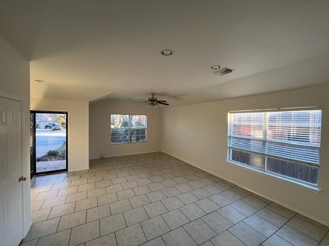 908 Rocking Spur Cove Pflugerville, TX 78660 - Photo 3 of 28 a view of an empty room with a window
