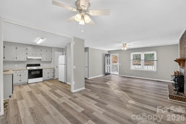a view of a kitchen with stove and cabinets